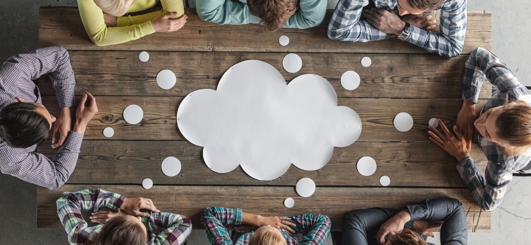 Business owners sitting at a table discussing Money